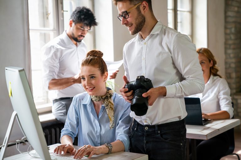 Creative startup young multiethnic business people working together at designer agency in office