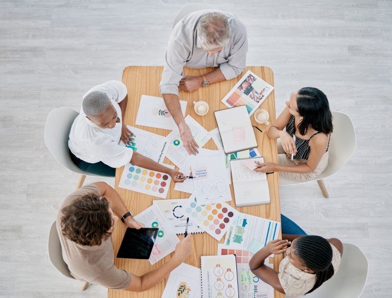 Team work, hands or creative business people in a meeting planning a logo, branding or marketing co